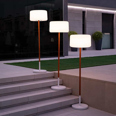 Newgarden's Chloe Plant: An elegant floor lamp with a unique blend of wood and polyethylene. Customizable for any space.